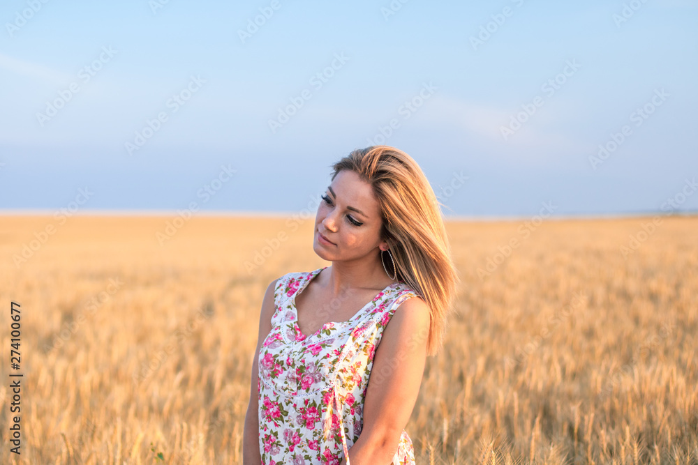 young seductive rural blond hair woman in dress on the yellow wheat field on the sunset young seductive rural blond hair woman in dress on the yellow wheat field on the sunset