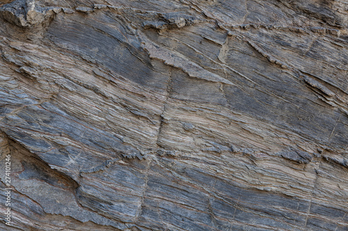 Textura de pedra natural. Superfície texturizada de rocha natural, onde se podem ver as linhas desenhadas na rocha ao longo do tempo. Pode ser usada como fundo.