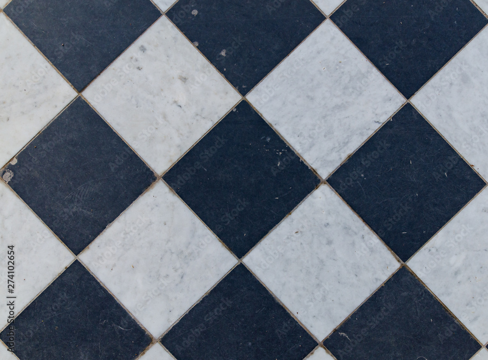Fototapeta premium Black and white wintage checkered floor tiles.