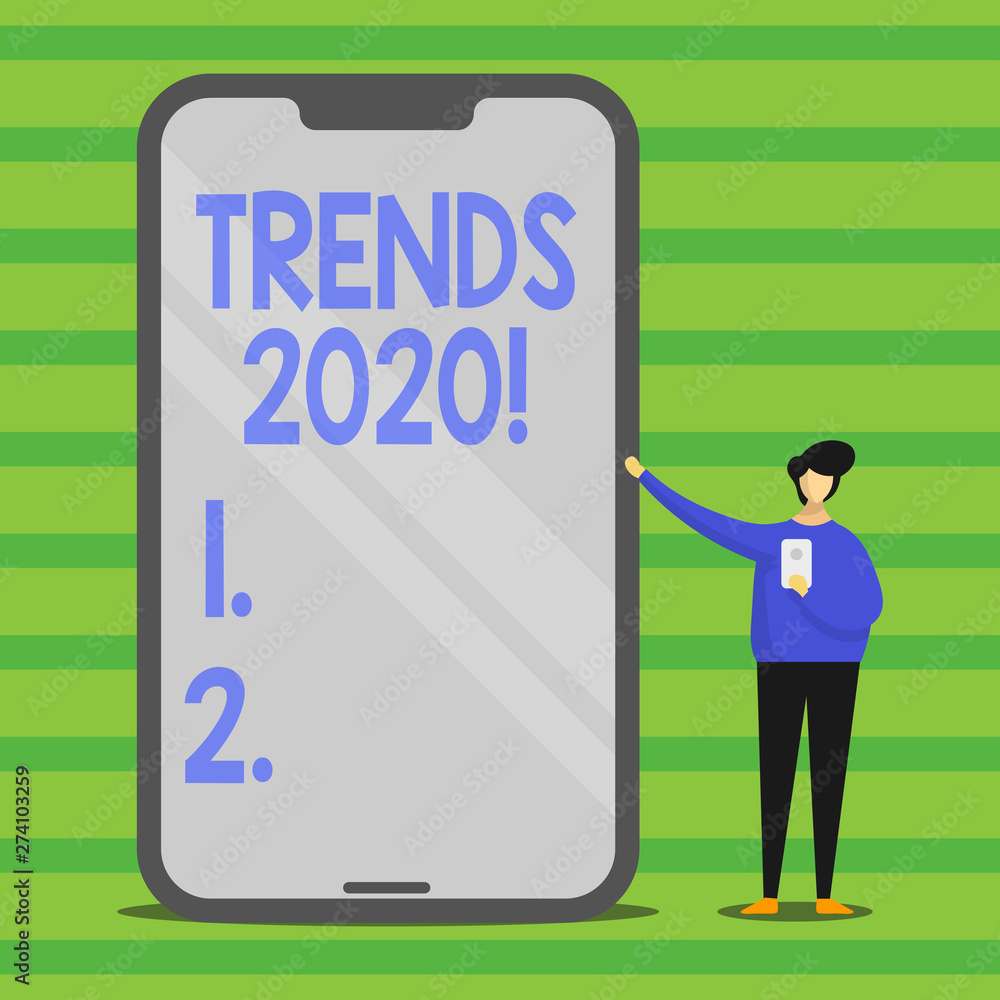 Word writing text Trends 2020. Business photo showcasing general direction in which something is developing next year Man Presenting Huge Blank Screen Smartphone while Holding Another Mobile Word writing text Trends 2020. Business photo showcasing general direction in which something is developing next year Man Presenting Huge Blank Screen Smartphone while Holding Another Mobile