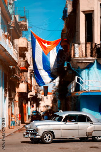 Photography Antique car and cuban flag in Old Havana