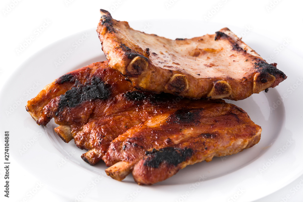 Grilled barbecue ribs isolated on white background. Close up Grilled barbecue ribs isolated on white background. Close up