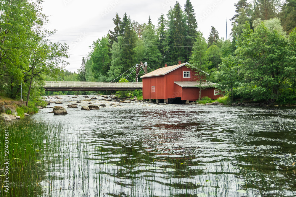 Fototapeta premium Old mill, dam and threshold on the river Jokelanjoki, Kouvola, Finland