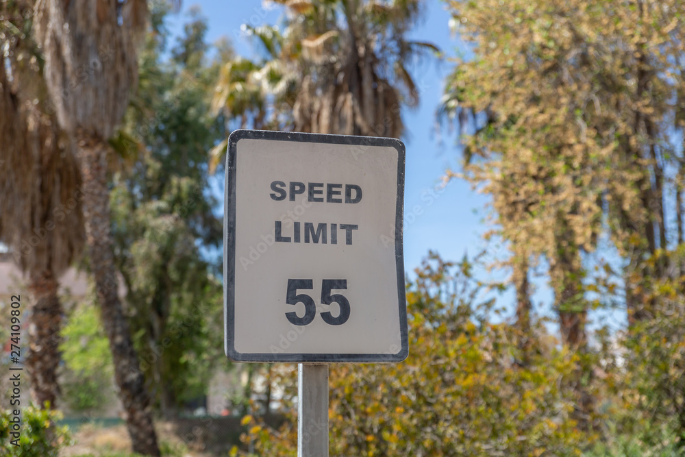 Speed limit signal of 55 miles per hour