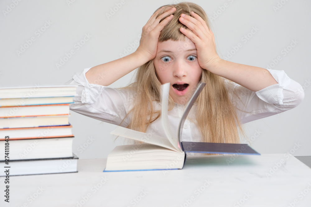 The girl saw something incredible in the book. The girl saw something incredible in the book.