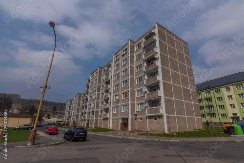 Block of flats in Kraslice town in soon spring cloudy day photo