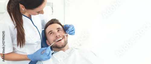 Young man at the dentist photo