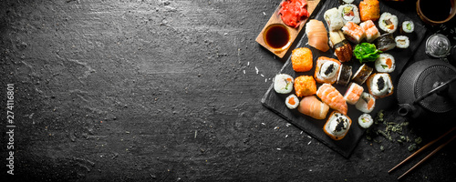 Japanese sushi rolls with salmon, avocado and shrimp.
