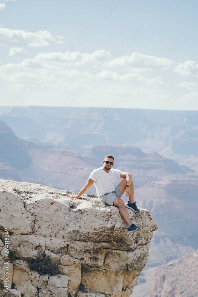 man exploring the grand canyon in Arizona during the summer