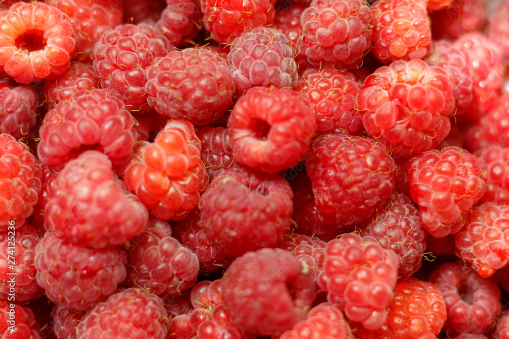 Heap of sweet red raspberries close up for background Heap of sweet red raspberries close up for background