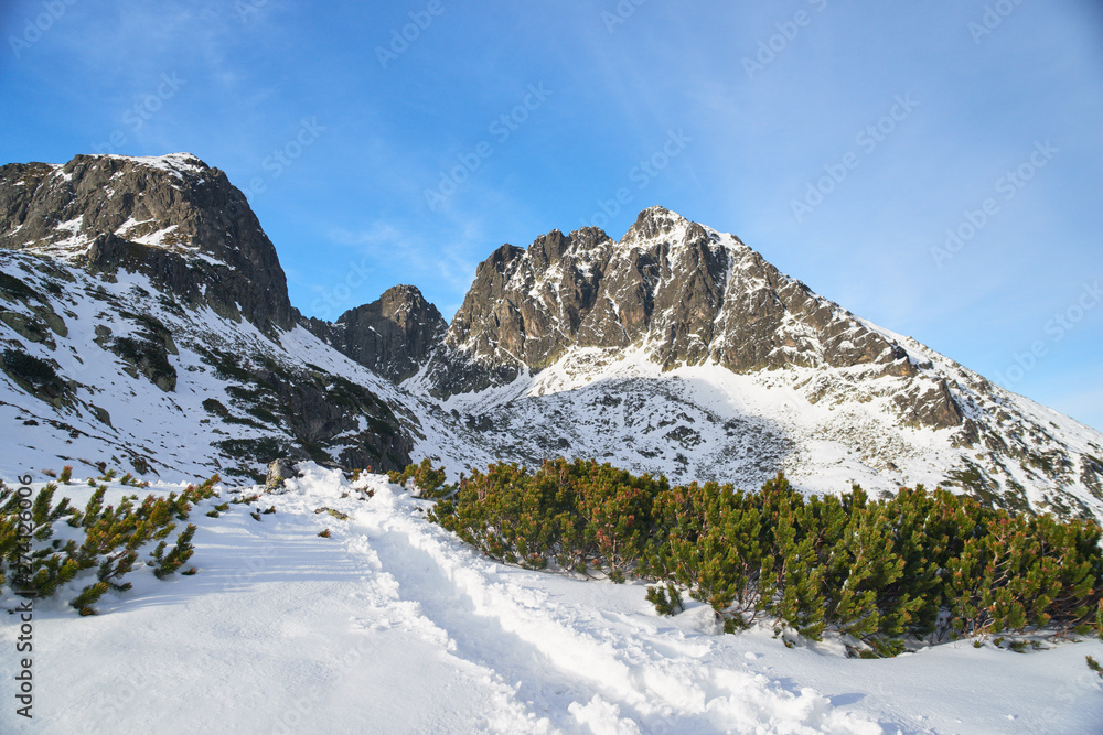 Scienic view of narrow trail in Tatras mountaines covered with snow Scienic view of narrow trail in Tatras mountaines covered with snow