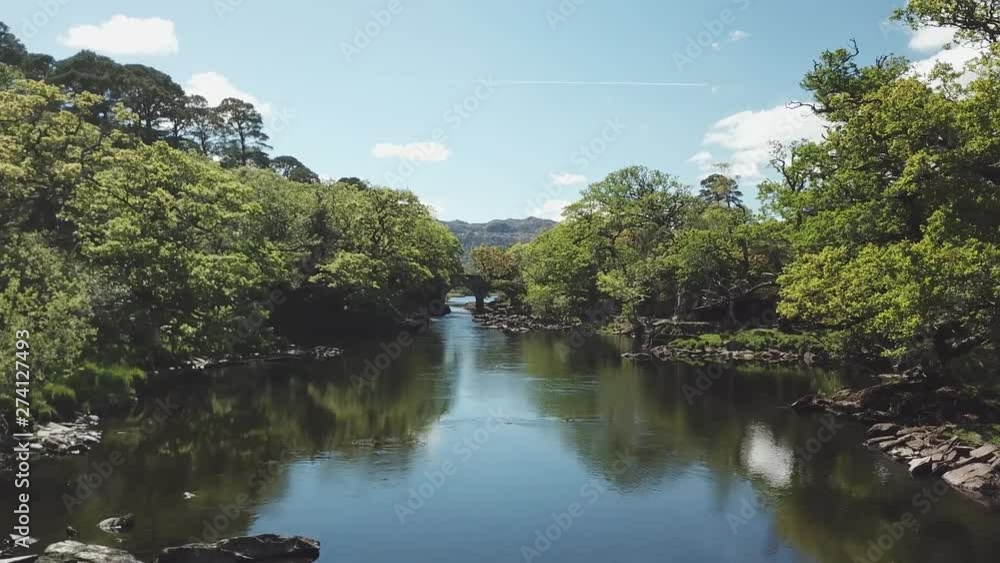 Old Weir Bridge in Killarney National Park, Ireland, Meeting of the two waters Old Weir Bridge in Killarney National Park, Ireland, Meeting of the two waters