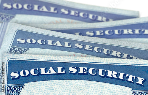 U.S. Social Security Cards In Perspective View With Shallow Depth Of Field Isolated On White Background photo