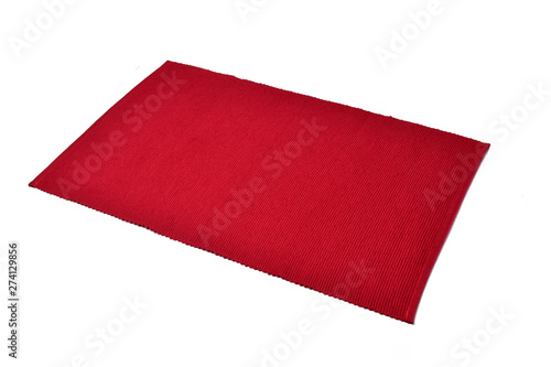 Red cotton placemat isolated on white background.