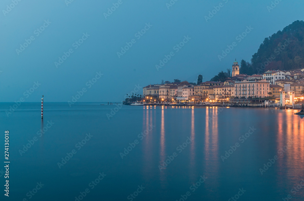 Bellagio city on Lake Como in blue during a foggy evening Bellagio city on Lake Como in blue during a foggy evening