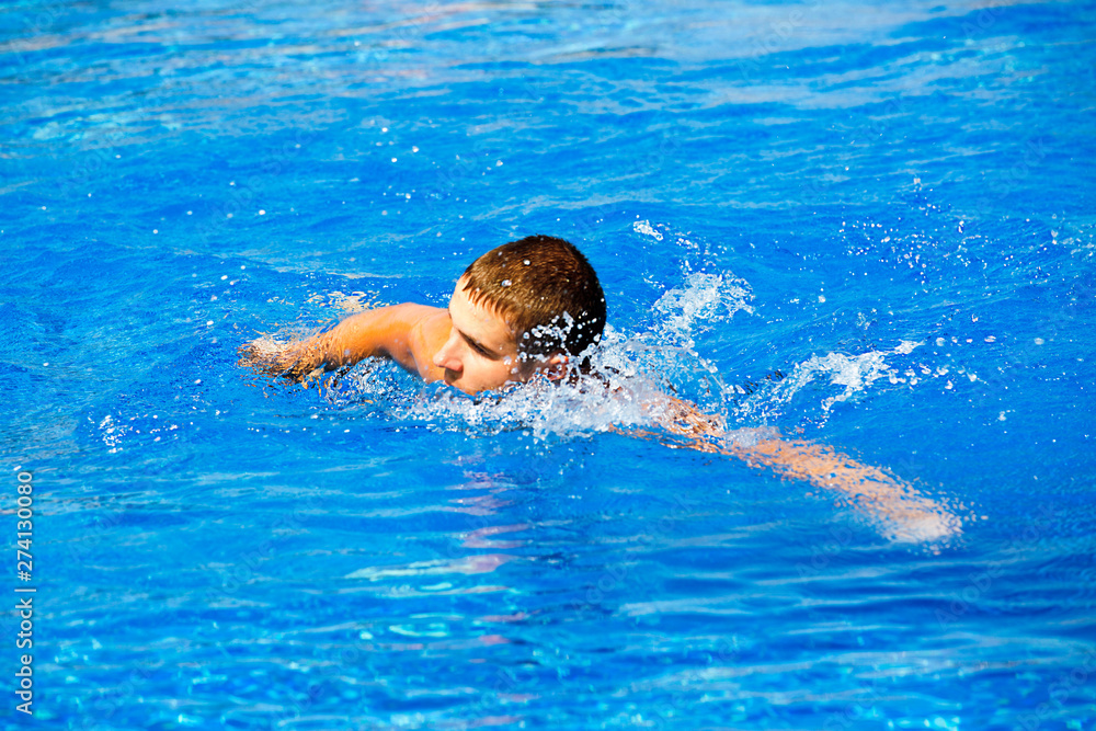 Man swims in the pool in Cyprus