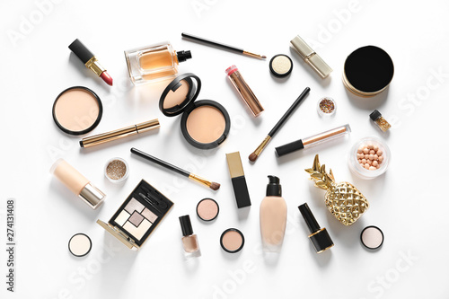 Set of luxury makeup products on white background, top view