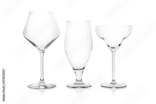 Set of empty glasses for different drinks on white background