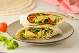 Wraps or torttila. Avocado, vegan wrap sandwiches. Healthy food.