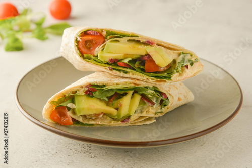 Wraps or torttila. Avocado, vegan wrap sandwiches. Healthy food.