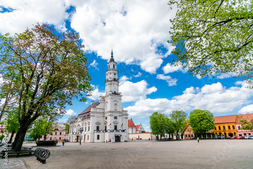 Town Hall White Swan in the center of Kaunas at the Town Hall Square in Lithuania in the spring against a blue sky with cirrus clouds