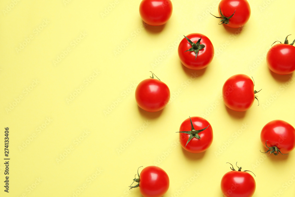 Flat lay composition with cherry tomatoes on color background. Space for text - obrazy, fototapety, plakaty 