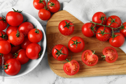 Flat lay composition with fresh cherry tomatoes on marble background