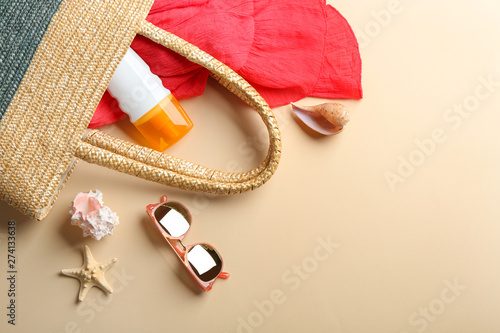 Flat lay composition with beach accessories on color background. Space for text
