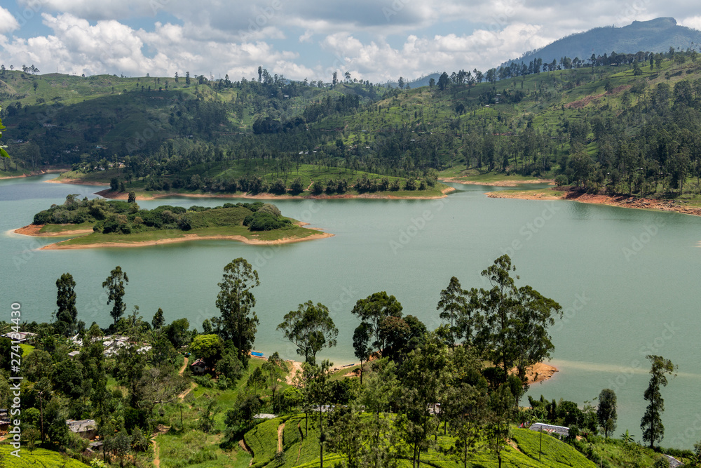 Sri Lanka Hill country landscape. Tea plantations and lake scenery. Nature scenery on bright, sunny day.