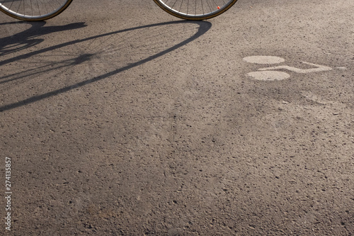 Bycicle and its reflection on bicycle lane