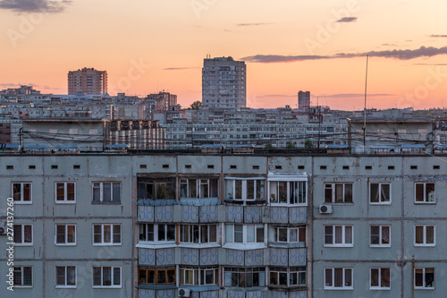 Windows, roofs and facade of an apartment building in Russia photo