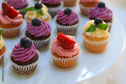 Tasty cupcakes on wedding table, closeup