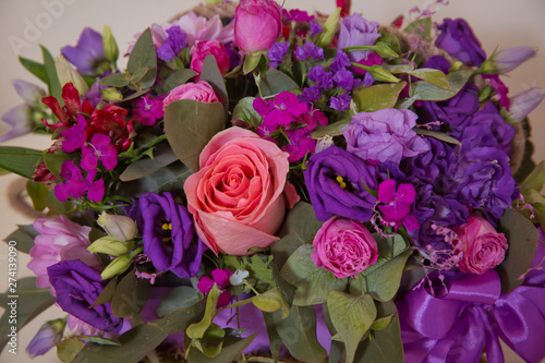 Beautiful wedding colorful purple bouquet for bride. Beauty of colored flowers. Flowers backgrounds . Four-legged rose bush . Beautiful bunch of purple flowers with white  red and yellow flowers .