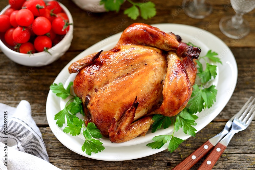 Roasted whole chicken. Delicious homemade food. Top view. Copy space. Roasted whole chicken. Delicious homemade food. Top view. Copy space.