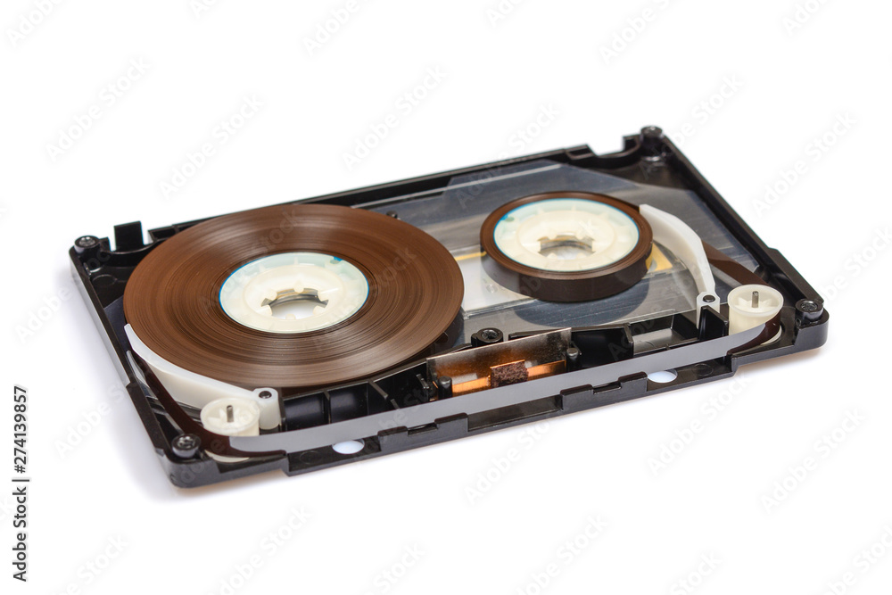 Disassembled audio compact cassette with SM mechanism. Audio cassette with tape guide as security mechanism, isolated on white background. Disassembled audio compact cassette with SM mechanism. Audio cassette with tape guide as security mechanism, isolated on white background.