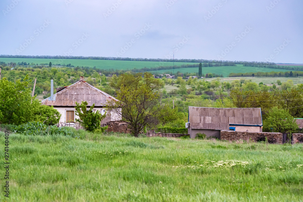 Rural houses in steppe countryside. Distant view Rural houses in steppe countryside. Distant view