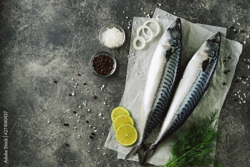 Fresh tasty raw mackerel with dill, lime, sea salt and black pepper. Top view. Copy space. 