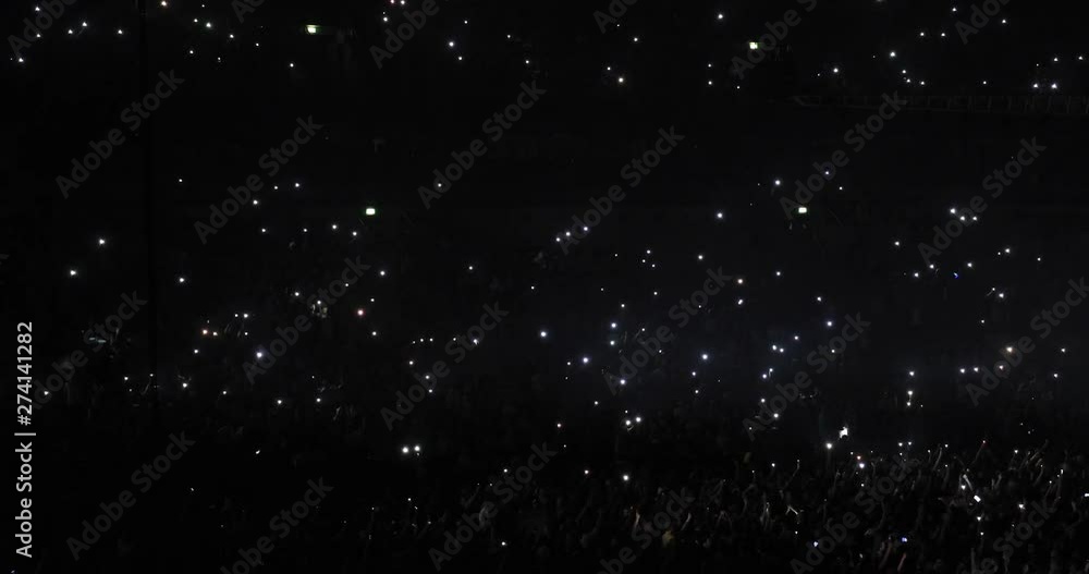 People Raise Their Hands With The Phone Lights In The Dark Concert Hall And Enjoy A Great Performance People Raise Their Hands With The Phone Lights In The Dark Concert Hall And Enjoy A Great Performance
