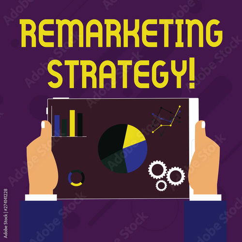 Writing note showing Remarketing Strategy. Business concept for reengage customers using information collected Hands Holding Tablet with Search Engine Optimization on the Screen photo