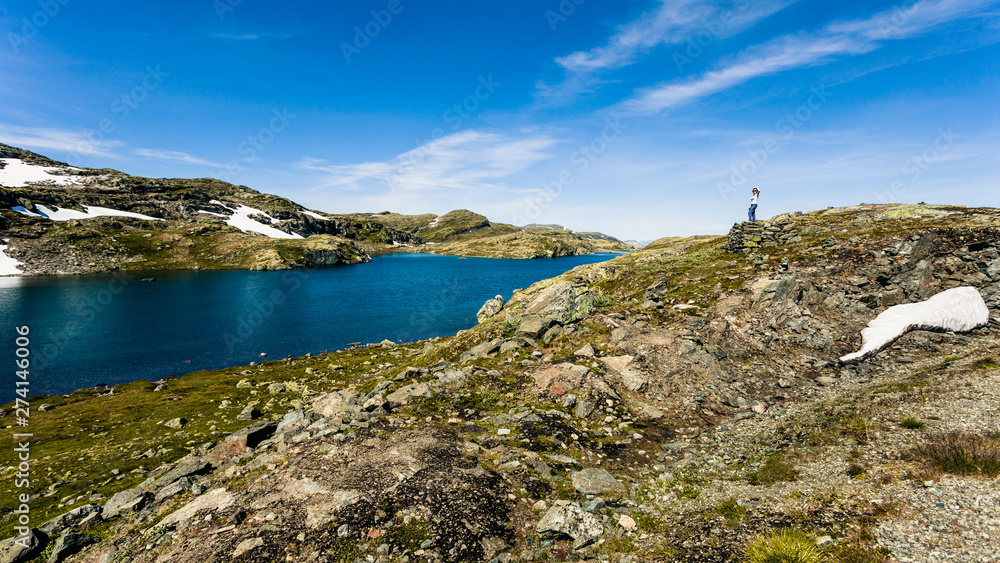 Tourist enjoying landscape norwegian nature