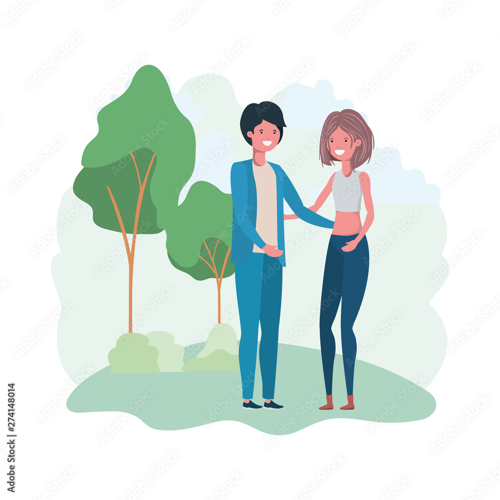 young couple in landscape with trees and plants young couple in landscape with trees and plants
