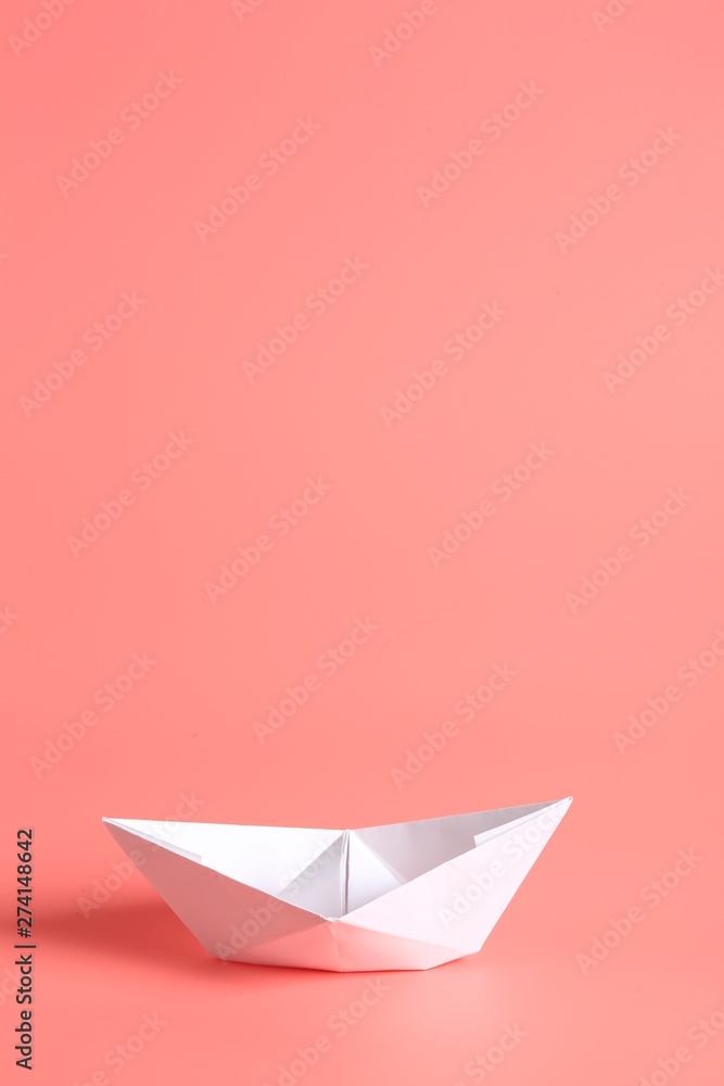 paper ship on a pink background. paper ship on a pink background.