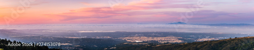 Panoramic view of Silicon Valley and the San Francisco bay area at sunset  Stanford University  Menlo Park  Mountain View  Redwood City  Foster City and Palo Alto visible under a layer of clouds
