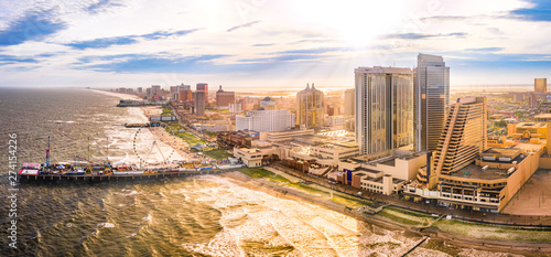 Obraz na płótnie Late afternoon aerial panorama of Atlantic city along the boardwalk. Atlantic City achieved nationwide attention as a gambling resort and currently has nine large casinos. w salonie