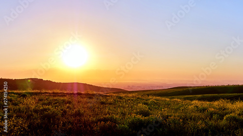 Panorama of a mountain valley in the summer. Fabulous sunset in the mountains  amazing nature  summer in the mountains. Travel and camping  tourism