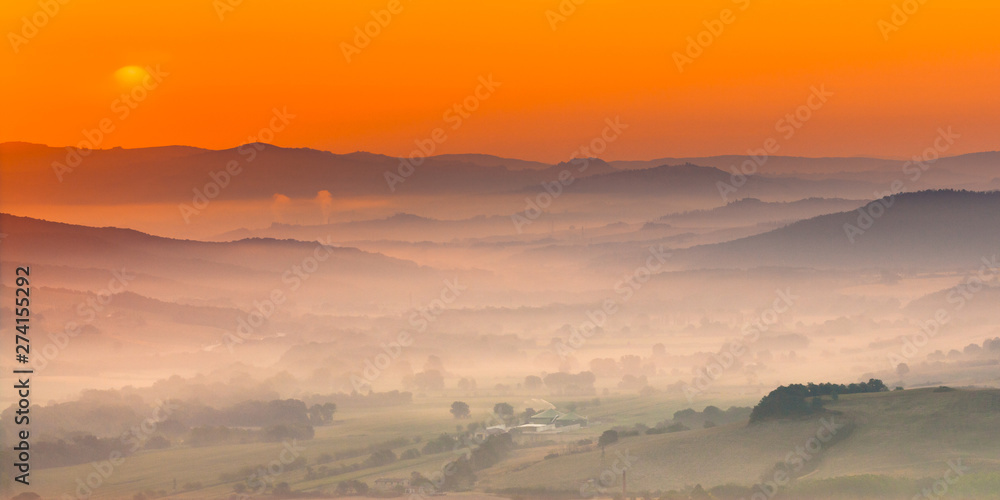 Tuscany orange foggy landscape scene