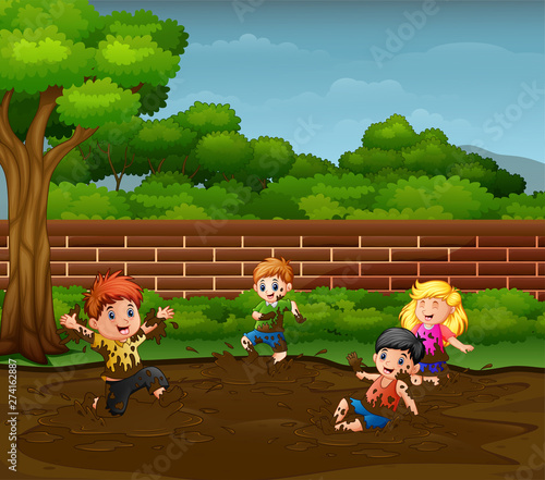 Children having fun playing in the mud