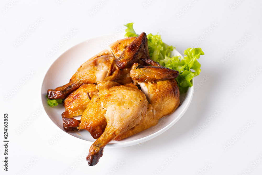 Chopped roasted chicken on white plate, isolated on white. Chopped roasted chicken on white plate, isolated on white.