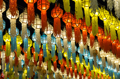 colorful hanging lanterns lighting on night sky in loy krathong festival at northern of thailand