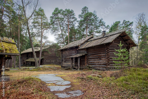  wooden village houses in the forest in the open-air ethnographic museum © Lana Kray